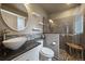 Updated bathroom with a walk-in shower, granite vanity, and modern fixtures at 3131 S Leyden St, Denver, CO 80222