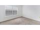Cozy, carpeted bedroom with a large window offering natural light at 7453 Singing Hills Dr, Boulder, CO 80301