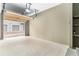 Spacious garage with epoxy floor, storage shelves, overhead lighting, and garage door opener at 7453 Singing Hills Dr, Boulder, CO 80301