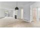 Spacious open-concept living area with fireplace, leading to dining and other rooms at 7453 Singing Hills Dr, Boulder, CO 80301