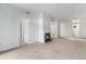 Cozy living room with a fireplace, carpet, and bright white walls at 7453 Singing Hills Dr, Boulder, CO 80301