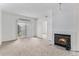 Inviting living room with sliding glass doors and a charming fireplace feature at 7453 Singing Hills Dr, Boulder, CO 80301