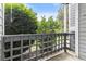 Private patio area with lattice railing, lush green bushes, and open space at 7453 Singing Hills Dr, Boulder, CO 80301