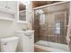 This bathroom features a glass shower and vanity with a white finish at 10535 Laurelglen Cir, Highlands Ranch, CO 80130