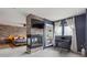 Stylish main bedroom with a double-sided fireplace, workspace, and custom shelving at 10535 Laurelglen Cir, Highlands Ranch, CO 80130