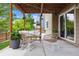 Outdoor patio with wicker furniture, a rug, and a sliding glass door leading to the interior at 10535 Laurelglen Cir, Highlands Ranch, CO 80130
