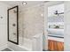 Updated bathroom with subway tile shower and bathtub at 1825 Albion St, Denver, CO 80220