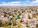 Aerial view of a home nestled in a community with mature trees and lush landscaping at 9743 Las Colinas Dr, Lone Tree, CO 80124