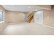 Expansive basement with neutral tones and a staircase leading to the upper level at 9743 Las Colinas Dr, Lone Tree, CO 80124
