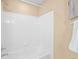 Clean bathroom features a shower and tub with white tiled walls and silver hardware at 9743 Las Colinas Dr, Lone Tree, CO 80124