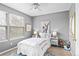 Comfortable bedroom with natural light and playful decor provides a relaxing retreat at 9743 Las Colinas Dr, Lone Tree, CO 80124