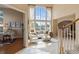 Inviting living room with high windows and an open layout leading to other living spaces at 9743 Las Colinas Dr, Lone Tree, CO 80124