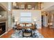 Cozy living room featuring a fireplace, hardwood floors, and stylish decor at 9743 Las Colinas Dr, Lone Tree, CO 80124