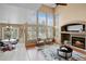 Spacious living area with large windows and an open layout flowing into the adjacent dining area at 9743 Las Colinas Dr, Lone Tree, CO 80124