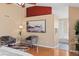 A spacious main bedroom with hardwood floors, accent chairs, en suite bathroom with soaking tub at 9743 Las Colinas Dr, Lone Tree, CO 80124