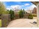 Backyard patio with privacy fence and mature trees, providing a cozy outdoor retreat at 9743 Las Colinas Dr, Lone Tree, CO 80124
