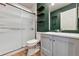Well-lit bathroom features a standing shower, stylish mirror, and modern vanity at 12919 W Burgundy Dr, Littleton, CO 80127