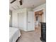 Bright bedroom with large closet and white trim offers ample storage space and access to the upper floor at 12919 W Burgundy Dr, Littleton, CO 80127