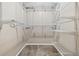 Walk-in closet features ample shelving and hanging space for optimal storage at 12919 W Burgundy Dr, Littleton, CO 80127
