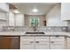 Kitchen sink with granite countertops and stainless steel appliances at 12919 W Burgundy Dr, Littleton, CO 80127