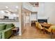 Bright living space featuring an open floor plan, sleek fireplace, and modern kitchen at 12919 W Burgundy Dr, Littleton, CO 80127