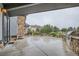 The backyard features a stone outdoor kitchen, firepit and a seating area at 15102 Prairie Pl, Broomfield, CO 80023