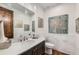 Stylish powder room with marble countertop and decorative wall art at 15102 Prairie Pl, Broomfield, CO 80023
