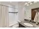 Clean bathroom with granite countertop, white subway tiles, and bathtub at 15102 Prairie Pl, Broomfield, CO 80023