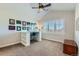 Bright bedroom featuring a built-in desk area and large window with shutter blinds at 15102 Prairie Pl, Broomfield, CO 80023