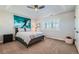 Cozy bedroom with a gray bed frame, large window with shutter blinds, and modern ceiling fan at 15102 Prairie Pl, Broomfield, CO 80023