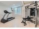 Bright basement exercise room with natural light and updated fitness equipment at 15102 Prairie Pl, Broomfield, CO 80023