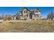 Two-story home with stone facade and landscaping at 15102 Prairie Pl, Broomfield, CO 80023