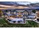 Luxury home with large backyard patio and fire pit at 15102 Prairie Pl, Broomfield, CO 80023