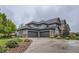 Beautiful two-story home boasting a three-car garage, stone accents, and meticulous landscaping at 15102 Prairie Pl, Broomfield, CO 80023