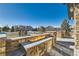 Outdoor fireplace and seating area provides a view of the neighborhood at 15102 Prairie Pl, Broomfield, CO 80023