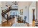 Grand foyer with staircase and beautiful hardwood floors at 15102 Prairie Pl, Broomfield, CO 80023