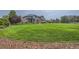 Expansive front yard showcases lush grass and professional landscaping at 15102 Prairie Pl, Broomfield, CO 80023