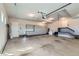 Spacious three car garage featuring an abundance of storage, projector and a side door at 15102 Prairie Pl, Broomfield, CO 80023