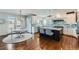 Bright kitchen with an eat-in area, custom cabinetry, and hardwood floors at 15102 Prairie Pl, Broomfield, CO 80023