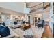 Spacious living area with hardwood floors, high ceilings, and seamless flow to kitchen at 15102 Prairie Pl, Broomfield, CO 80023