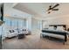 Spacious main bedroom featuring tray ceilings, sitting area, and natural light at 15102 Prairie Pl, Broomfield, CO 80023