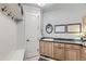 Mudroom area with built in storage, bench seating and sink area at 15102 Prairie Pl, Broomfield, CO 80023