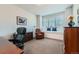 Home office with large window, plantation shutters, and window seat at 15102 Prairie Pl, Broomfield, CO 80023