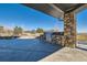 Backyard patio featuring an outdoor kitchen with a stainless steel grill and stone accents at 15102 Prairie Pl, Broomfield, CO 80023