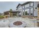 Backyard patio area features a built-in stone fire pit and outdoor kitchen with a grill at 15102 Prairie Pl, Broomfield, CO 80023
