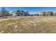 Large open yard featuring the house and snow remnants on the ground at 15102 Prairie Pl, Broomfield, CO 80023