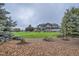 An expansive, meticulously maintained lawn and landscaping at 15102 Prairie Pl, Broomfield, CO 80023