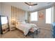 Comfortable bedroom with neutral decor, stylish accents and ample natural light at 400 E Fremont Pl # 207, Centennial, CO 80122