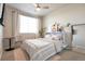 Well-lit bedroom with large window, modern decor and comfortable furnishings at 400 E Fremont Pl # 207, Centennial, CO 80122