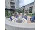 Inviting outdoor communal area featuring a central fire pit surrounded by stylish seating, creating a cozy gathering spot at 400 E Fremont Pl # 207, Littleton, CO 80122